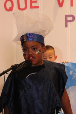 Student performing in awesome hat