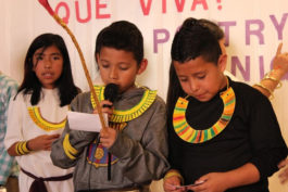 Student performing poetry they wrote