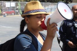 Student leading chants saying we are going to college